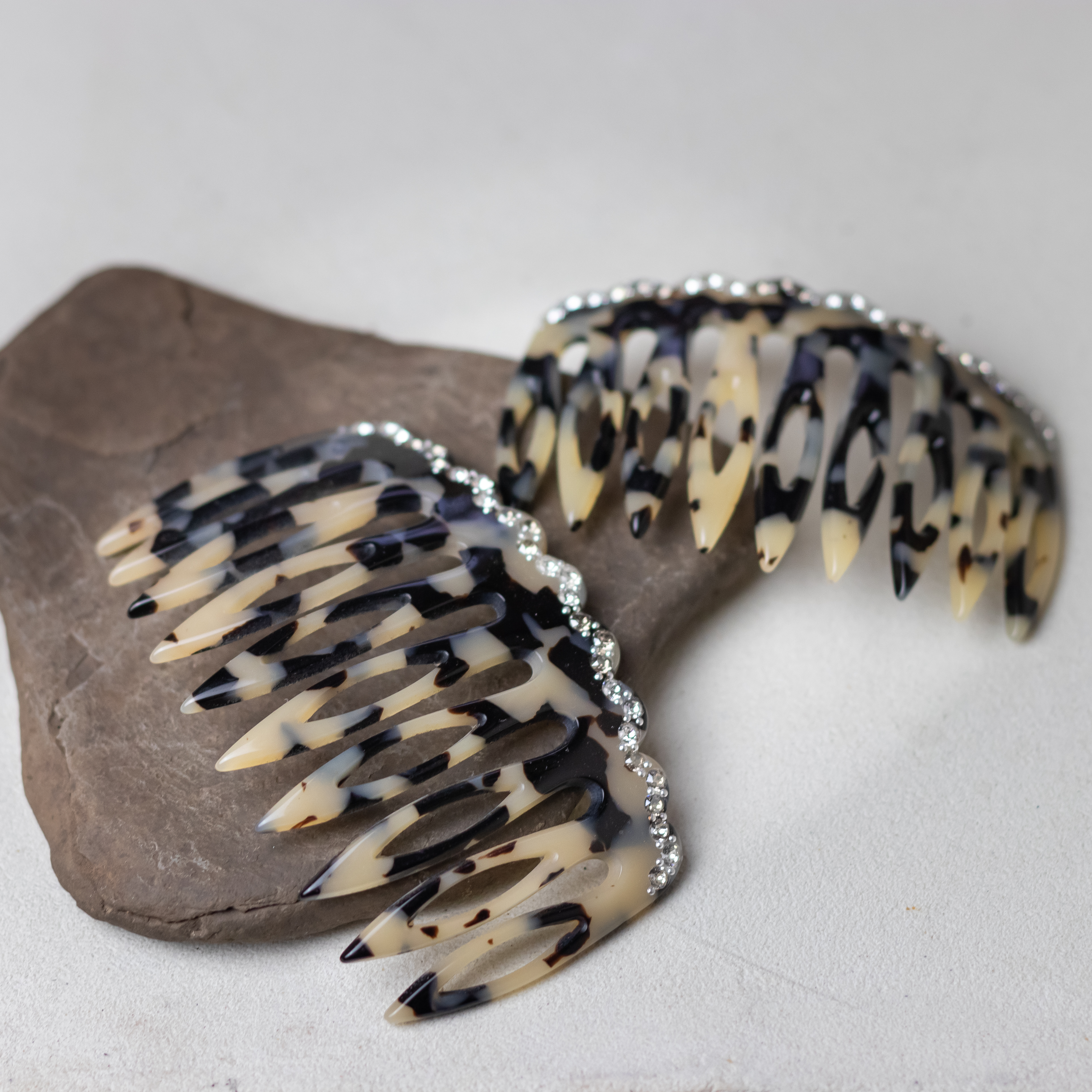 Woman wearing a MC Davidian Groovy Hair Comb GM in a side sweep hairstyle — handmade French cellulose acetate comb