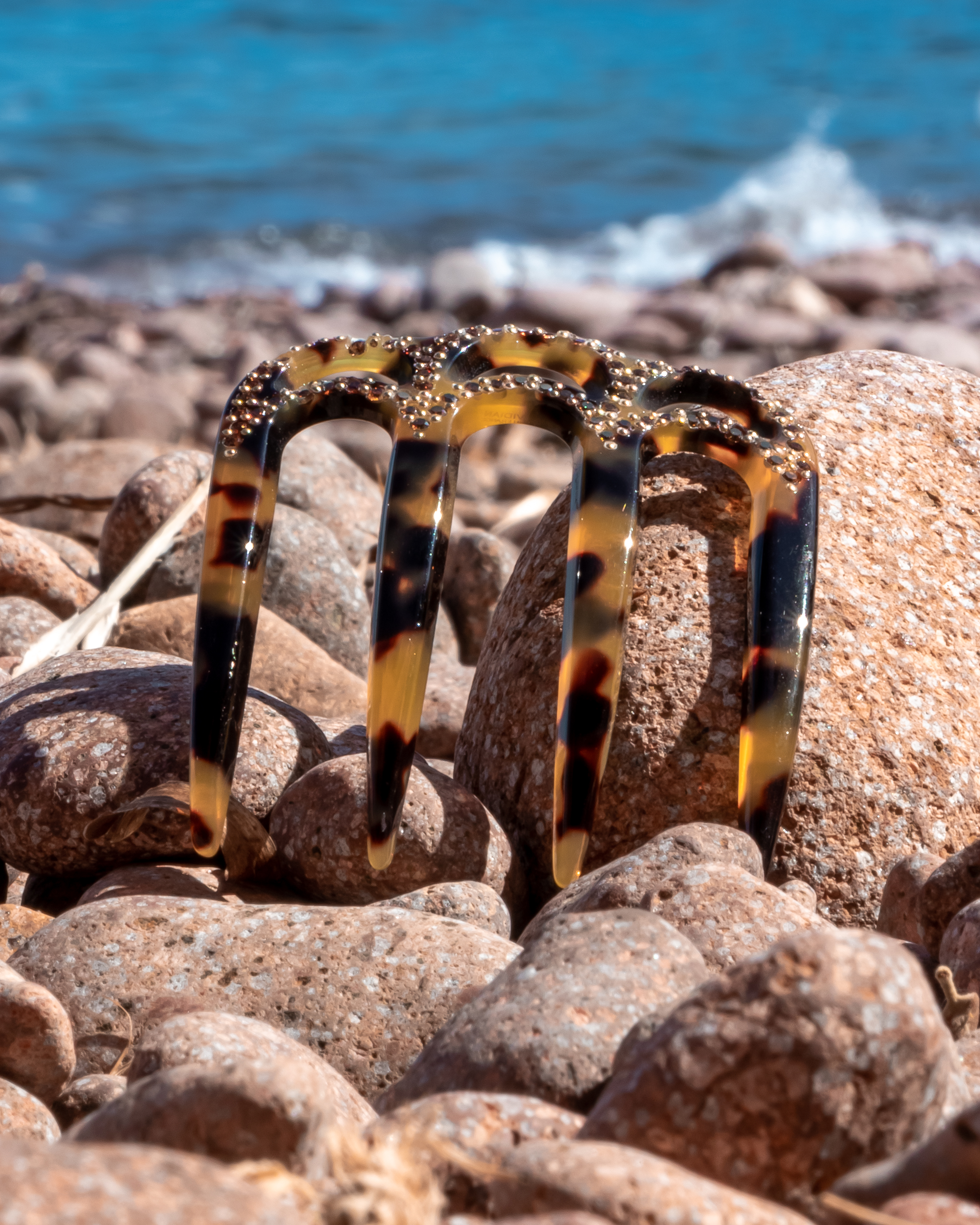 Woman wearing a MC Davidian Holiday Bright Comb MM — Swarovski rhinestone comb at the base of a ponytail